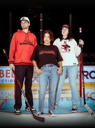 Three models on the ice wearing the Portland Winterhawks Halloween collection