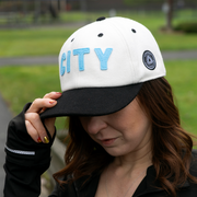 girl wearing a sioux falls city fc hat