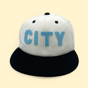 front of white wool sioux falls city fc hat with city embroidered on the front